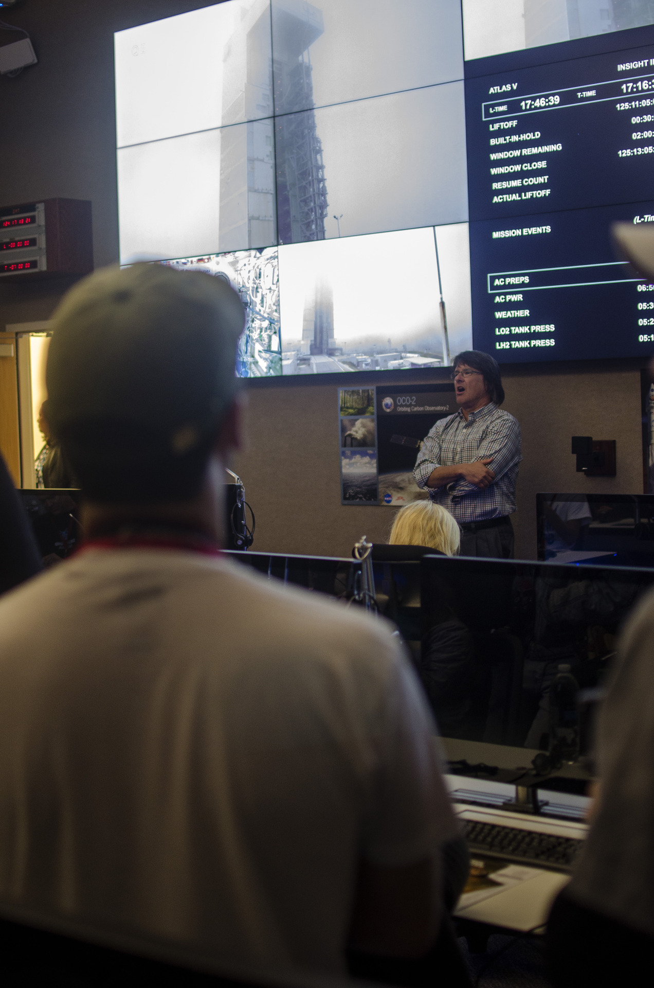 Inside the press site at Vandenberg during the InSight media days, screens and equipment filling the room